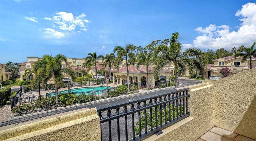 1116 Beachcomber Court, Unit 3 Osprey, FL 34229 - Photo 39 of 65 a view of a house with a balcony and a garden