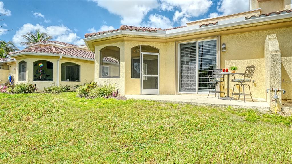 1116 Beachcomber Court, Unit 3 Osprey, FL 34229 - Photo 45 of 65 a front view of a house with a yard