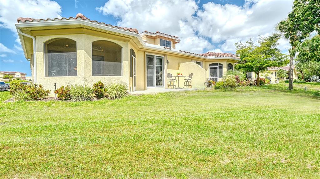 1116 Beachcomber Court, Unit 3 Osprey, FL 34229 - Photo 46 of 65 a view of a house with a garden