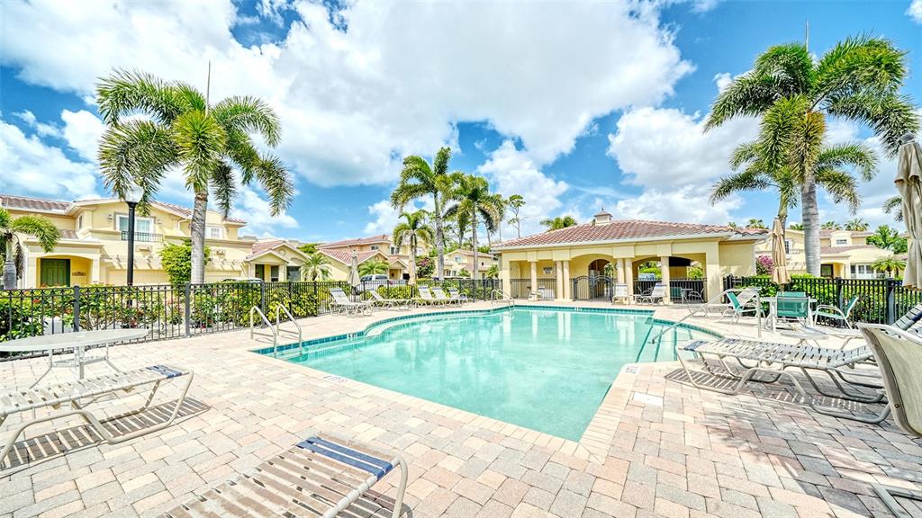 1116 Beachcomber Court, Unit 3 Osprey, FL 34229 - Photo 48 of 65 a view of a house with pool and sitting area
