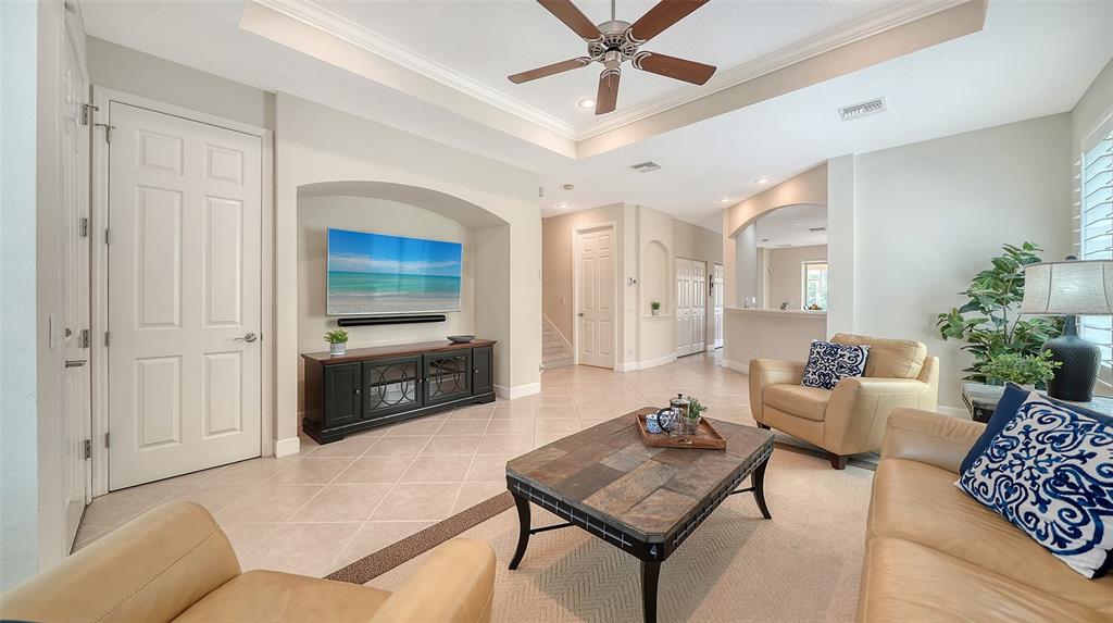 1116 Beachcomber Court, Unit 3 Osprey, FL 34229 - Photo 5 of 65 a living room with furniture and a flat screen tv