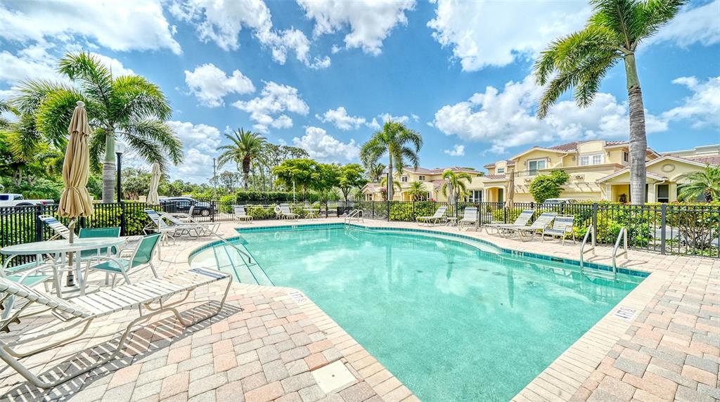 1116 Beachcomber Court, Unit 3 Osprey, FL 34229 - Photo 51 of 65 a swimming pool with outdoor seating and yard