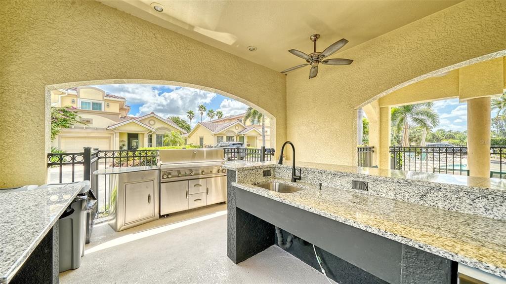 1116 Beachcomber Court, Unit 3 Osprey, FL 34229 - Photo 55 of 65 a large bathroom with a granite countertop sink and a large mirror