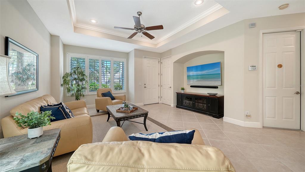1116 Beachcomber Court, Unit 3 Osprey, FL 34229 - Photo 6 of 65 a living room with furniture and windows