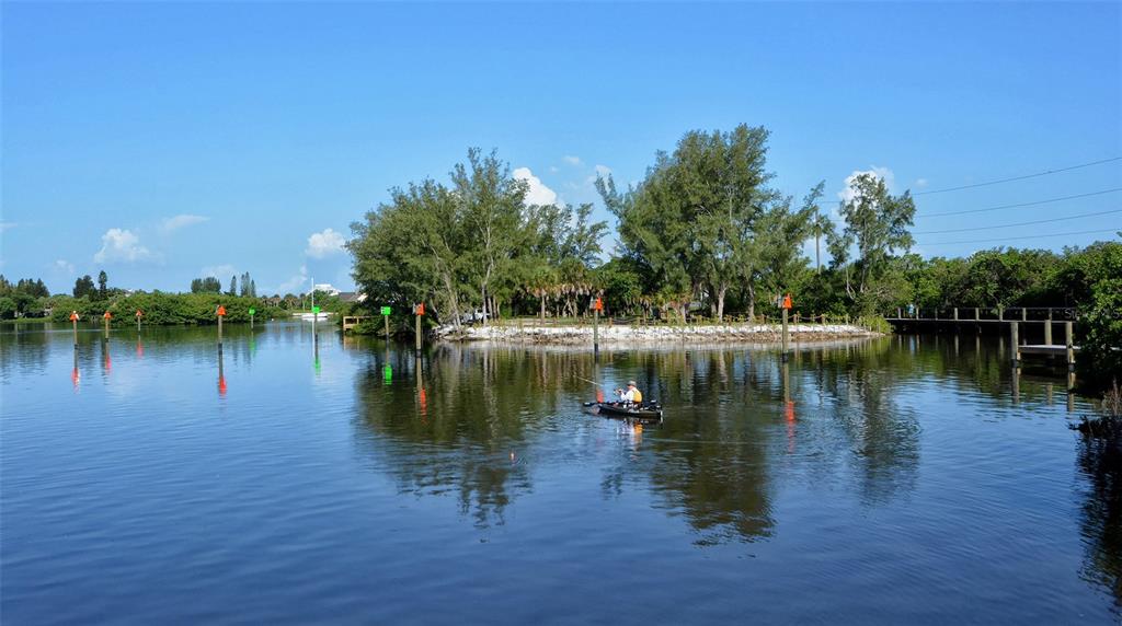 1116 Beachcomber Court, Unit 3 Osprey, FL 34229 - Photo 65 of 65 a view of a lake with houses