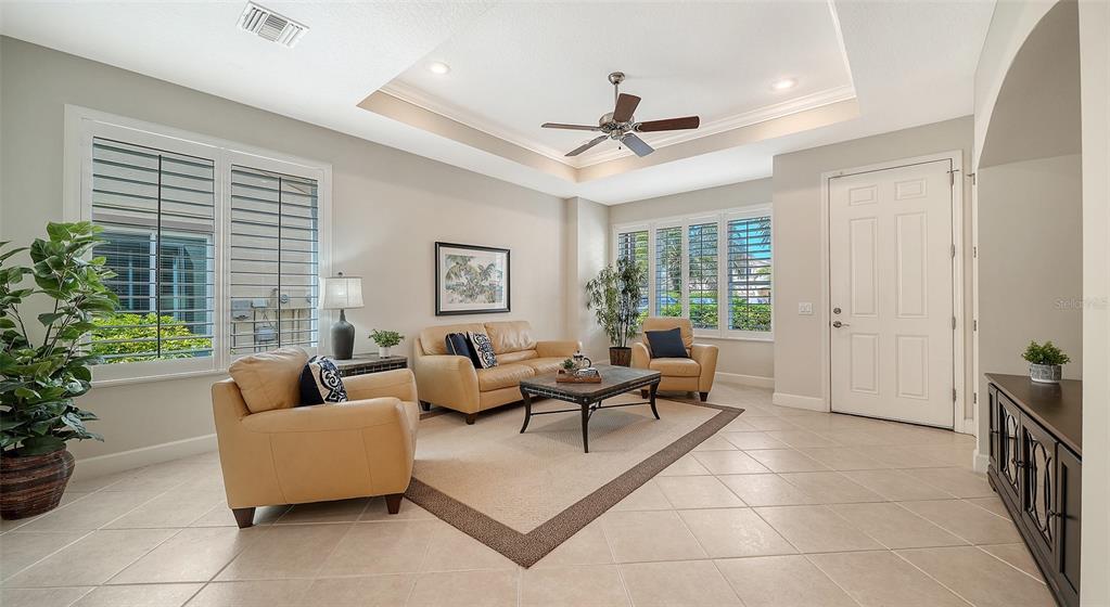 1116 Beachcomber Court, Unit 3 Osprey, FL 34229 - Photo 8 of 65 a living room with furniture and a large window