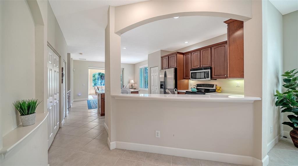 1116 Beachcomber Court, Unit 3 Osprey, FL 34229 - Photo 9 of 65 a view of kitchen with stainless steel appliances a refrigerator and a counter top space