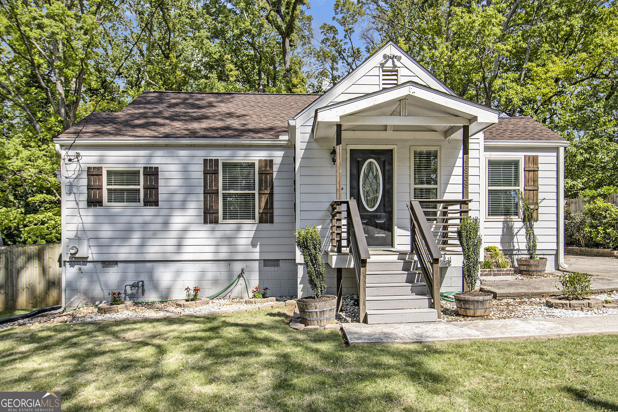 1858 Ridgeland Drive Decatur, GA 30032 - Photo 1 of 1 a front view of a house with garden
