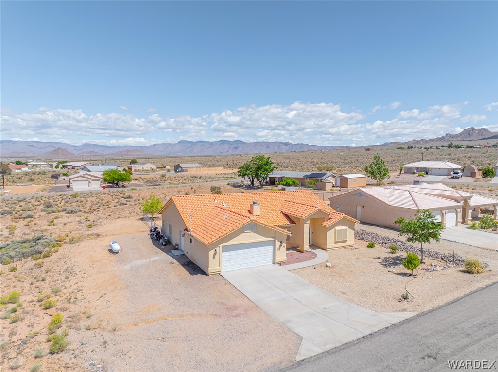 9332 Branded Road Kingman, AZ 86401 - Photo 37 of 44 an aerial view of residential houses with outdoor space