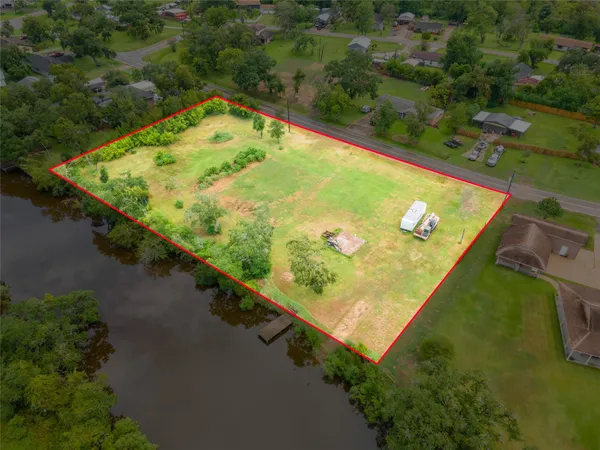 an aerial view of swimming pool with a yard