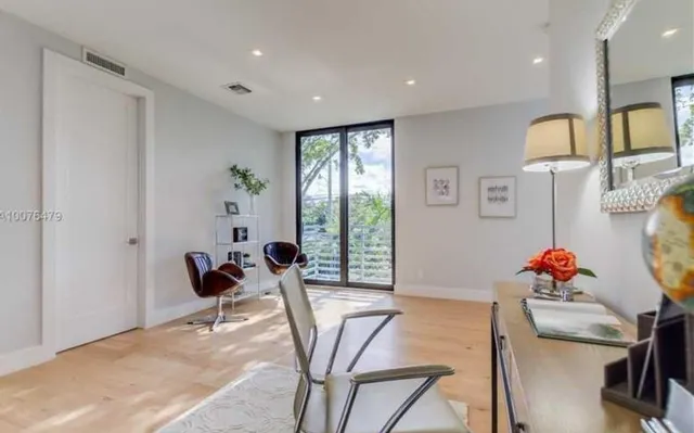 a livingroom with furniture and dining table