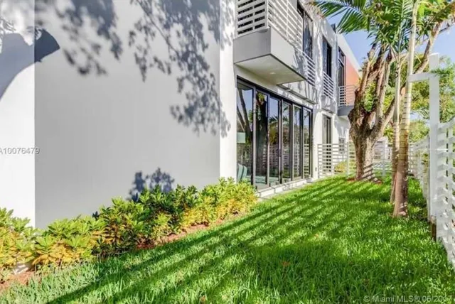 front view of a house with a garden