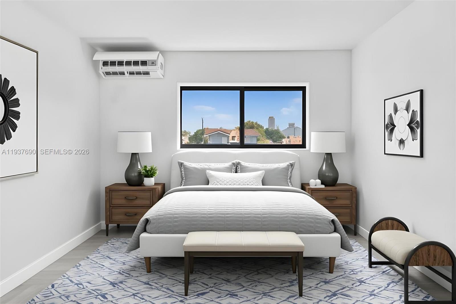 1027 Southwest 3rd Street, Unit 5 Miami, FL 33130 - Photo 3 of 6 a bedroom with a bed and a painting on the wall