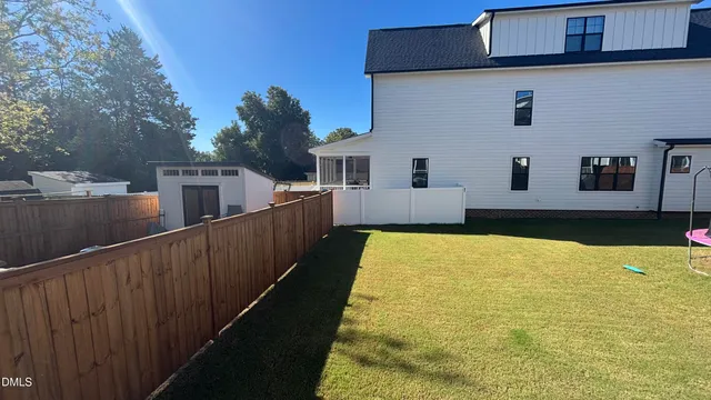 a view of house with swimming pool