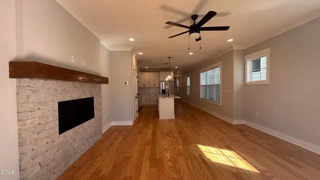 a view of a living room a window and a fireplace