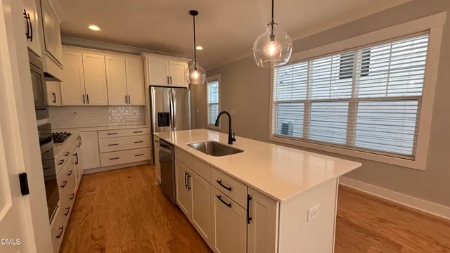 a kitchen that has a lot of cabinets in it