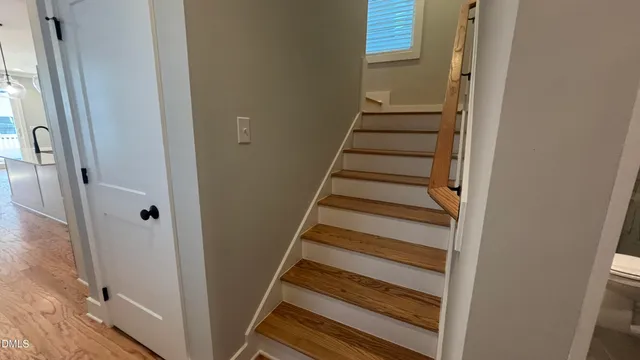 a view of a staircase with wooden floor