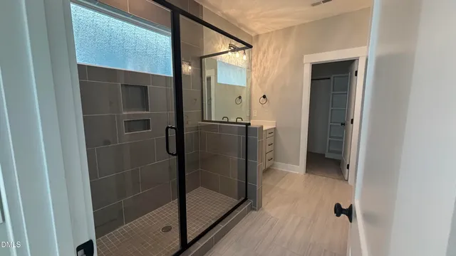 a bathroom with a granite countertop toilet
