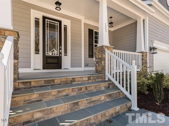 a view of a house with a large window and wooden floor