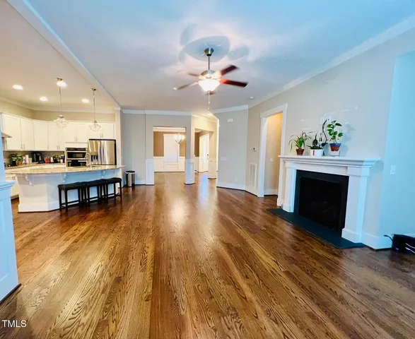 a view of a kitchen with furniture and a fireplace