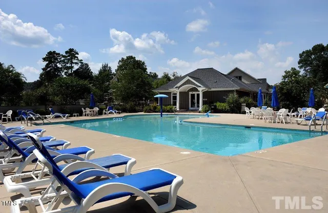 a view of pool with outdoor seating