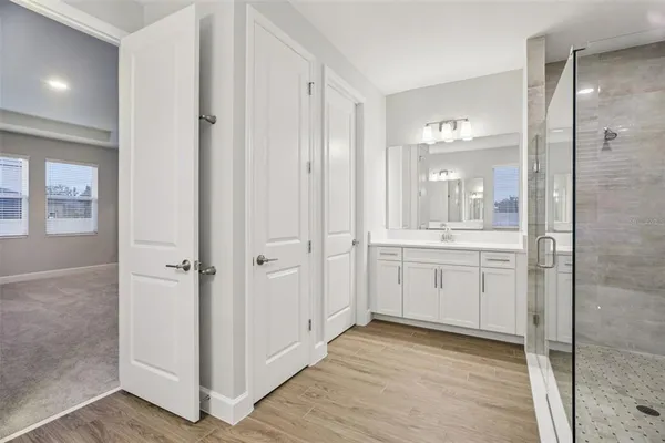a bathroom with a shower and a sink