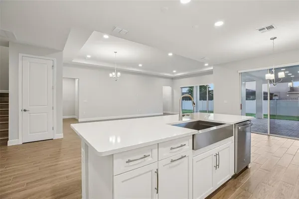 a kitchen with a sink and cabinets