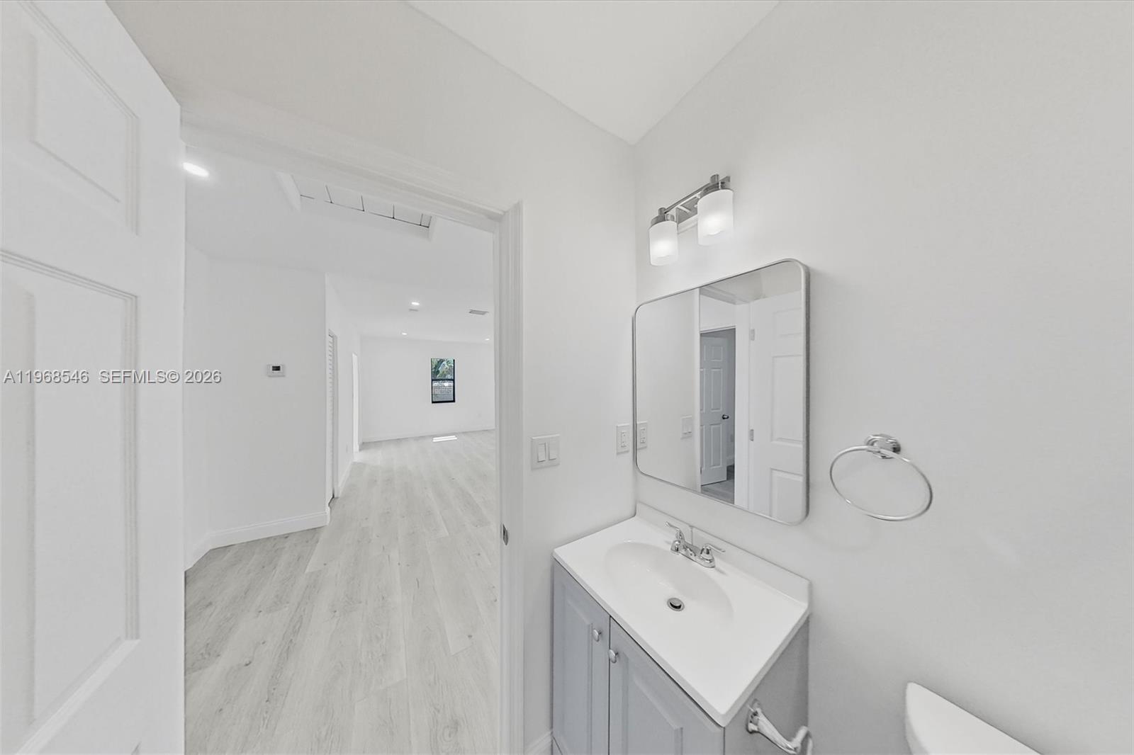 4237 Southwest 7th Street Miami, FL 33134 - Photo 18 of 31 a bathroom with a sink a mirror and shower