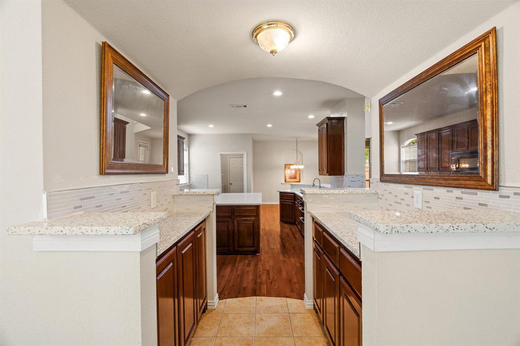 2012 Burnside Drive Allen, TX 75013 - Photo 26 of 40 a kitchen with a sink and a refrigerator