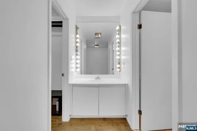a bathroom with a sink and a mirror