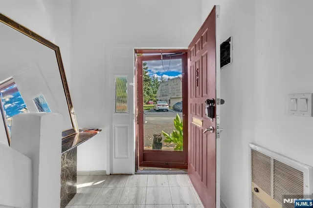 a view of an entryway and wooden floor