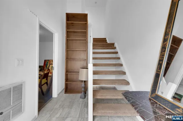 a view of closet area with empty racks
