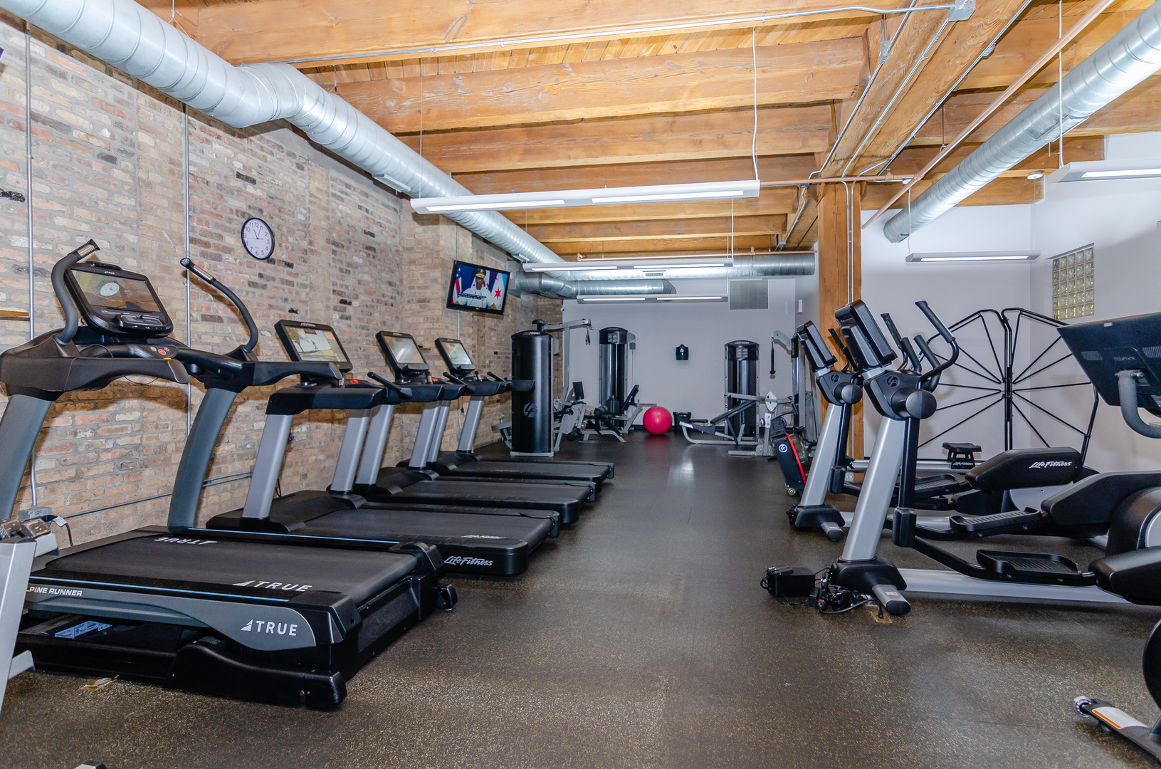1040 West Adams Street, Unit 257 Chicago, IL 60607 - Photo 13 of 15 a view of a room with gym equipment