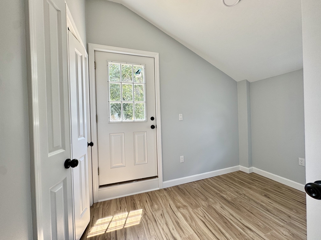 201 Belmont Street, Unit 2 Everett, MA 02149 - Photo 14 of 19 a view of empty room with wooden floor and fan