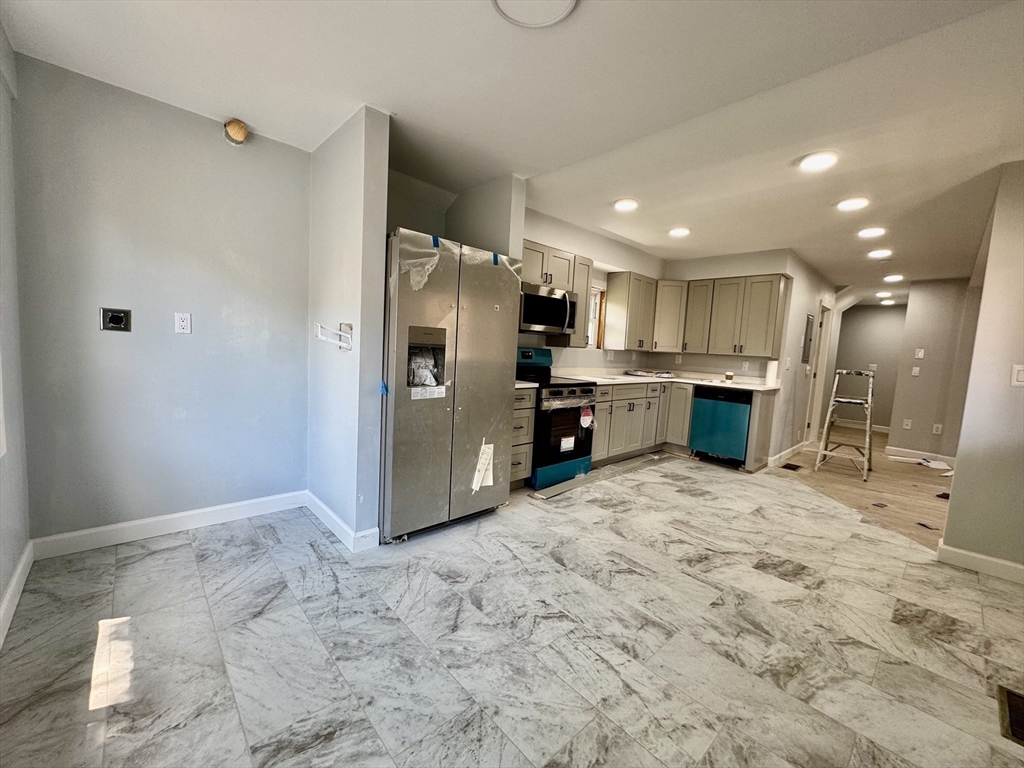 201 Belmont Street, Unit 2 Everett, MA 02149 - Photo 4 of 19 a view of kitchen and refrigerator