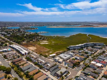 an aerial view of residential building with ocean view