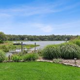 a view of a lake with houses in the back