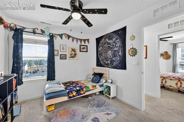 a bedroom with furniture and window