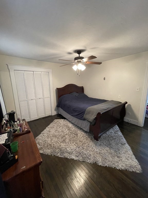 9 Thayer Street Worcester, MA 01603 - Photo 11 of 18 a living room with a bed furniture and a chandelier