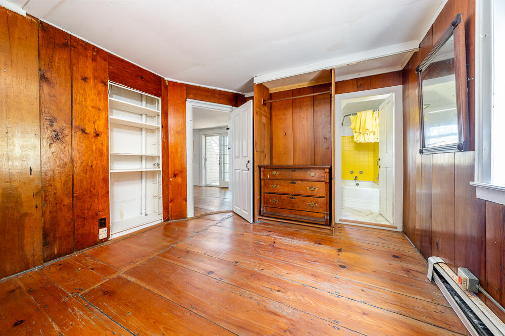 46 South Pamet Road Truro, MA 02666 - Photo 16 of 68 a view of empty room with wooden floor and cabinet