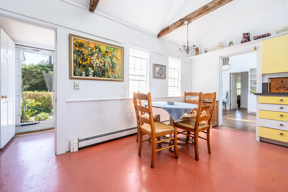 46 South Pamet Road Truro, MA 02666 - Photo 28 of 68 a dining room with furniture and a floor to ceiling window