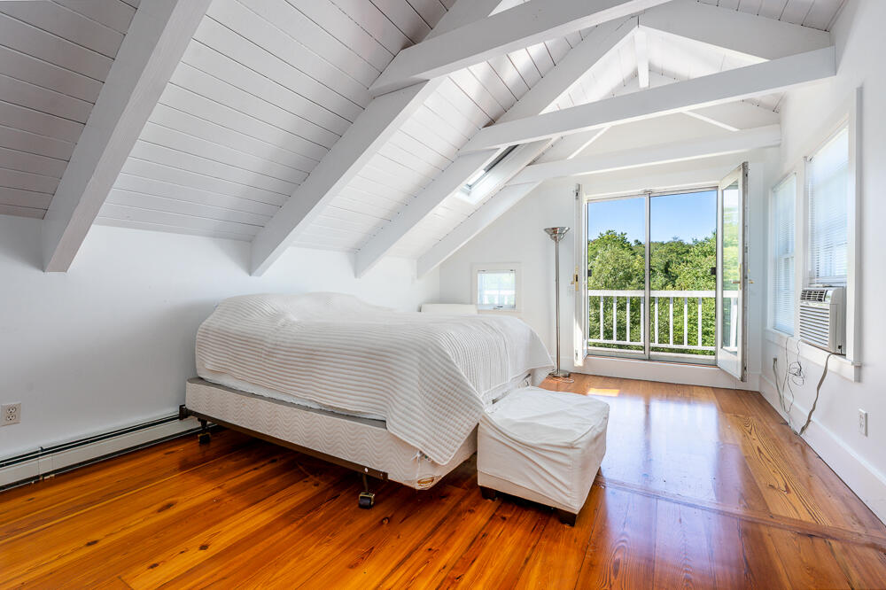 46 South Pamet Road Truro, MA 02666 - Photo 36 of 68 a bedroom with a bed and a large window