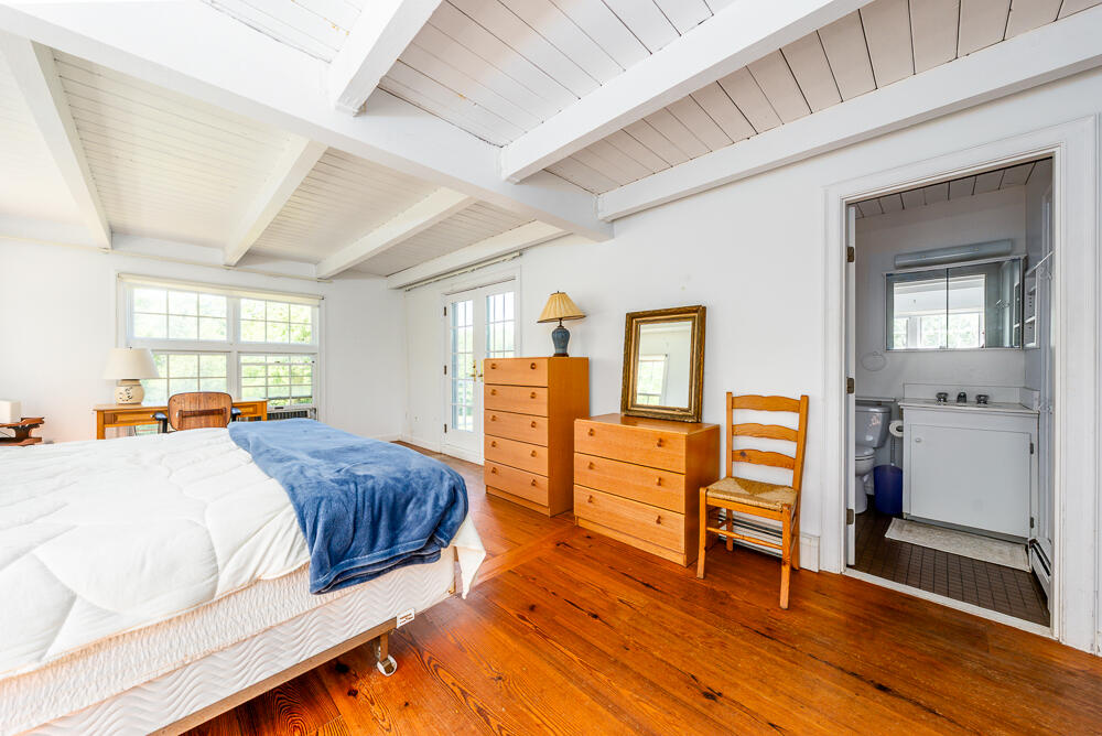 46 South Pamet Road Truro, MA 02666 - Photo 43 of 68 a bedroom with a bed and wooden floor