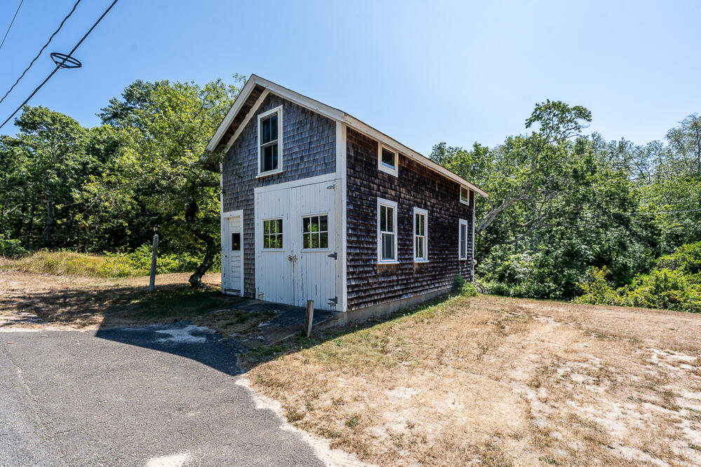 46 South Pamet Road Truro, MA 02666 - Photo 60 of 68 a front view of a house with a yard