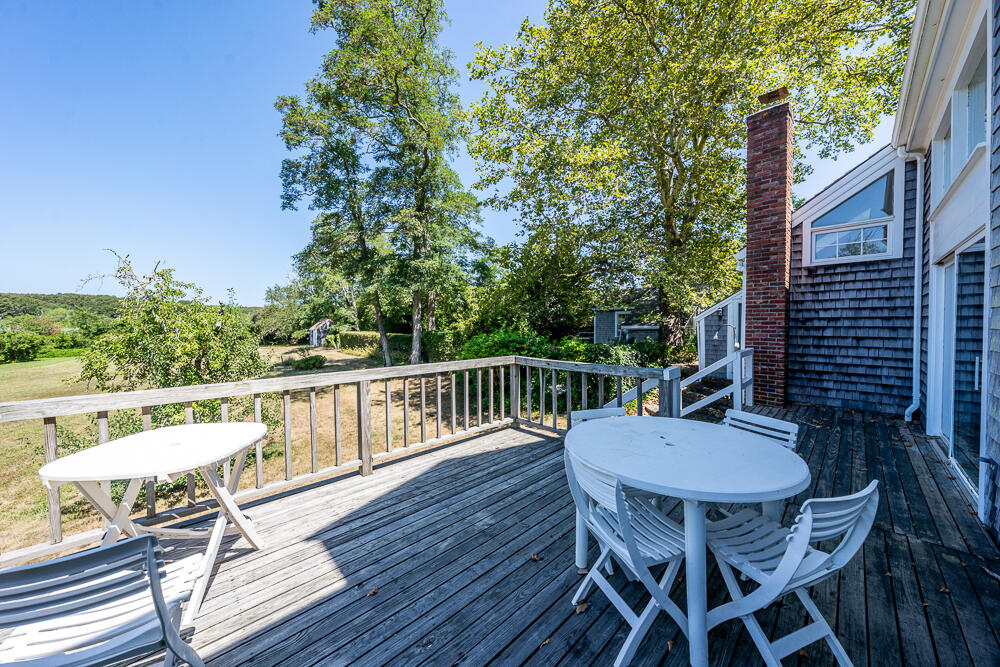 46 South Pamet Road Truro, MA 02666 - Photo 64 of 68 a balcony with wooden floor table and chairs