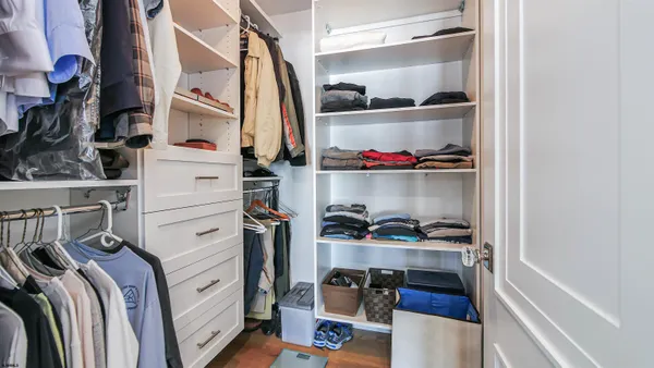 a bathroom with a sink mirror and shower