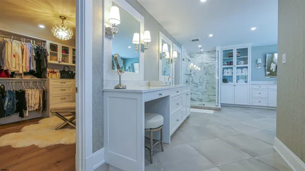 a spacious bathroom with a bathtub and sink
