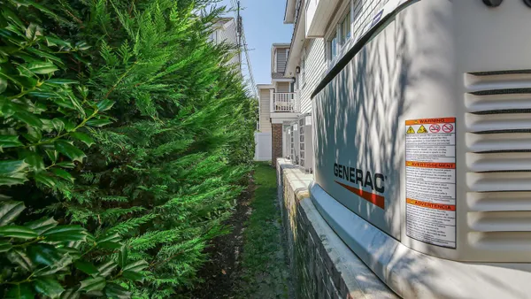 a view of a house with potted plants