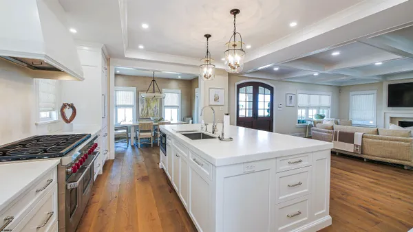 a bedroom with a bed a couch and dresser