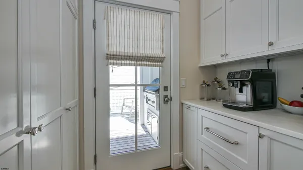a utility room with sink dryer and washer